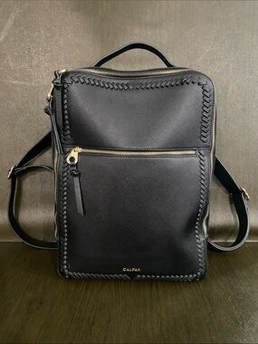 Calpak Kaya Black Faux Leather Backpack with Gold Hardware and Woven Trim